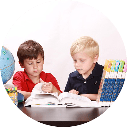 2 children reading together